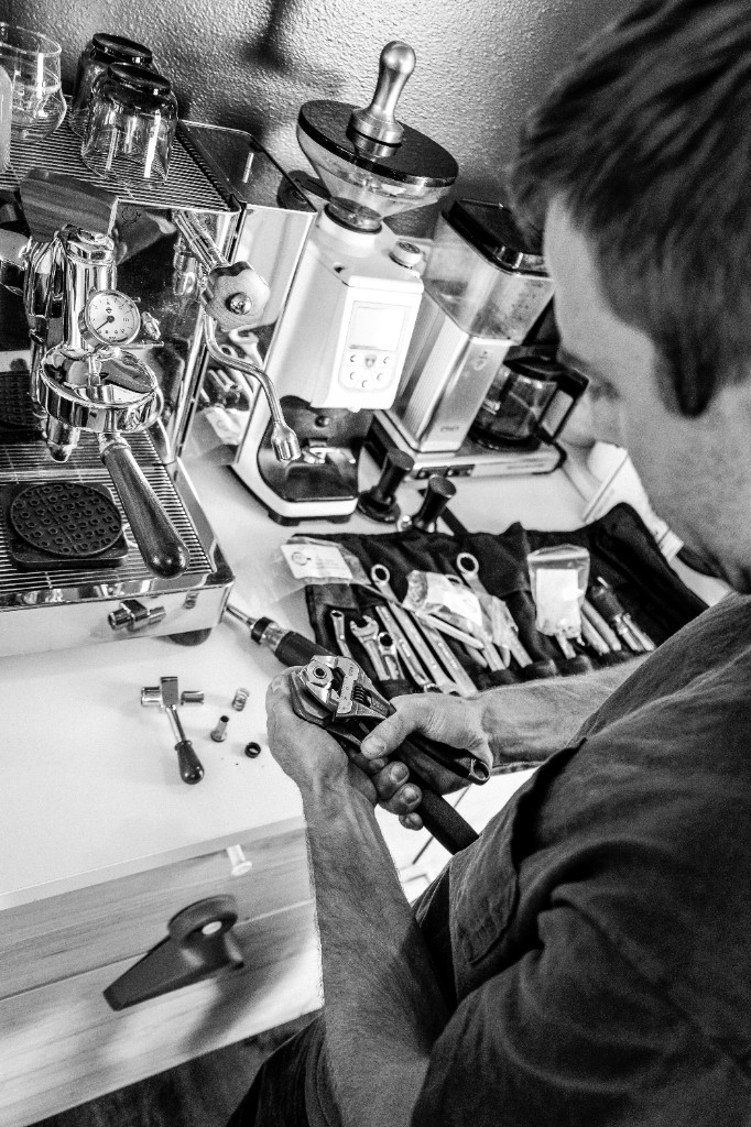 Austin Barr working on an espresso machine